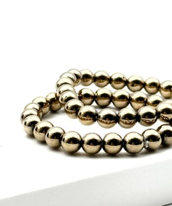 Guldfarvede elastik armbånd af metalliske halvædelsten